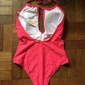 Fuchsia swimsuit.
